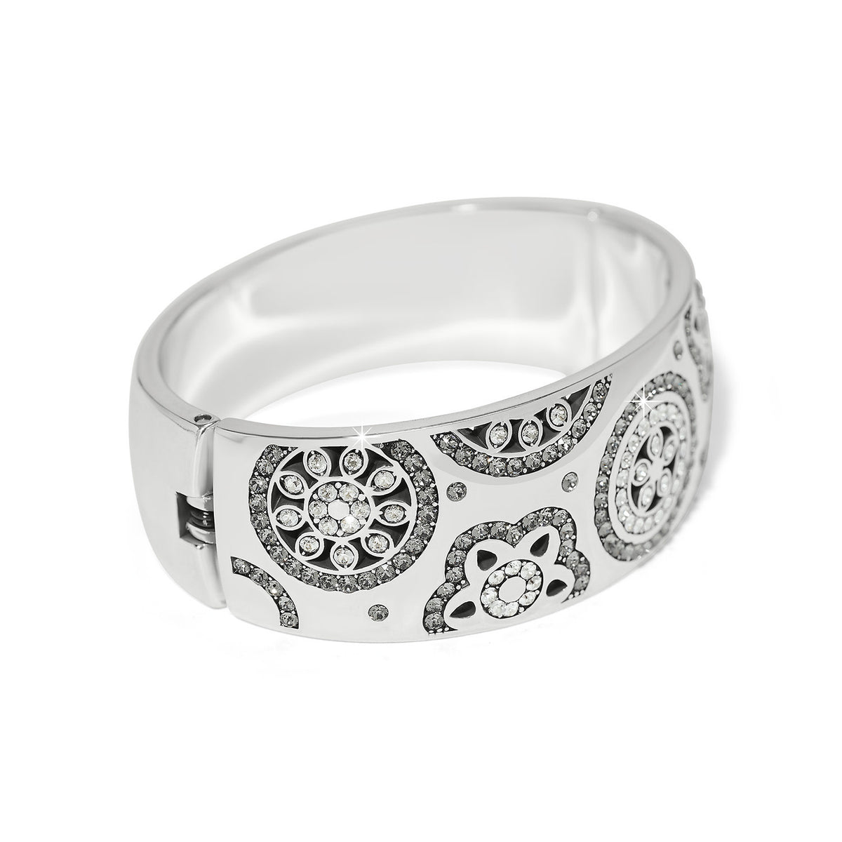 Silver plated wide hinged bangle bracelet featuring fine quality crystals in a bold feminine silhouette.
