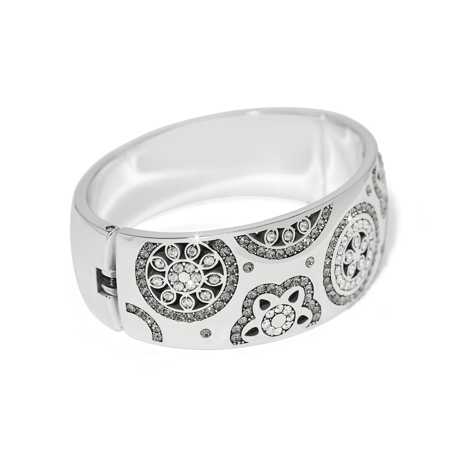 Silver plated wide hinged bangle bracelet featuring fine quality crystals in a bold feminine silhouette.