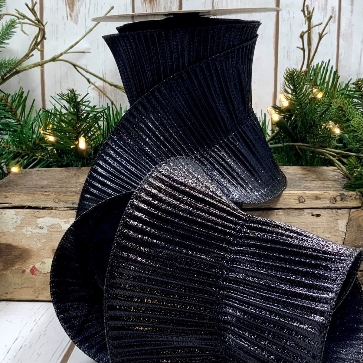 Black fluted lame ribbon with a smooth satin finish.