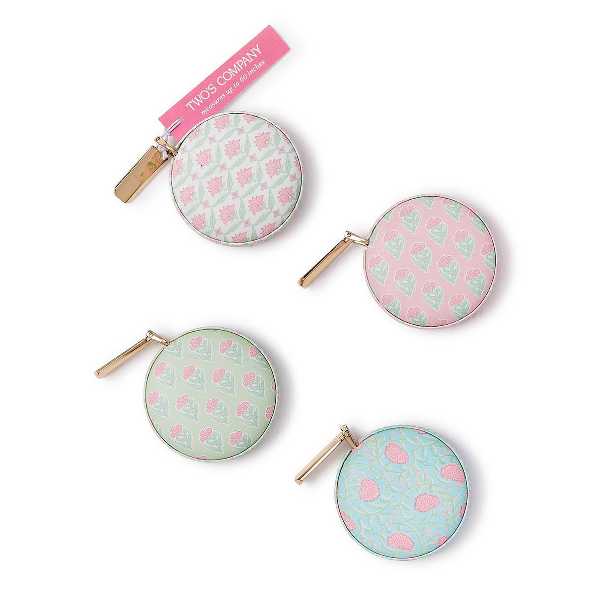 Floral block print measuring tape with vegan leather casing in pink.