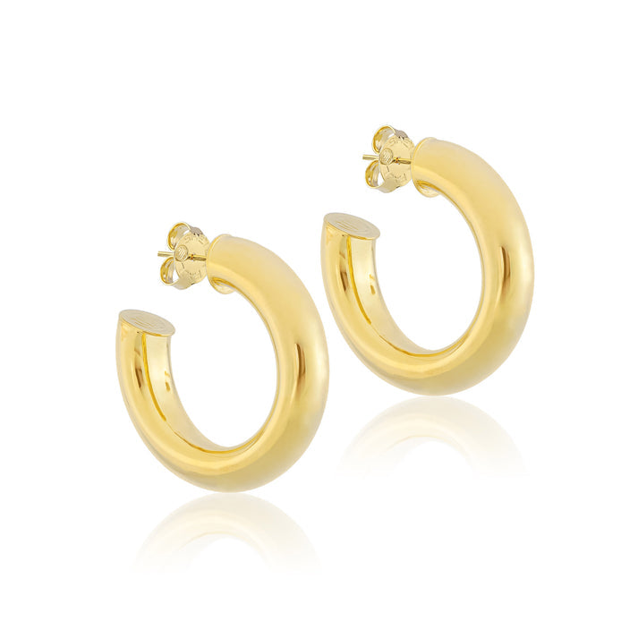 Small Chantal hoop earrings in shiny gold with a quarter-inch thick soldered seal.