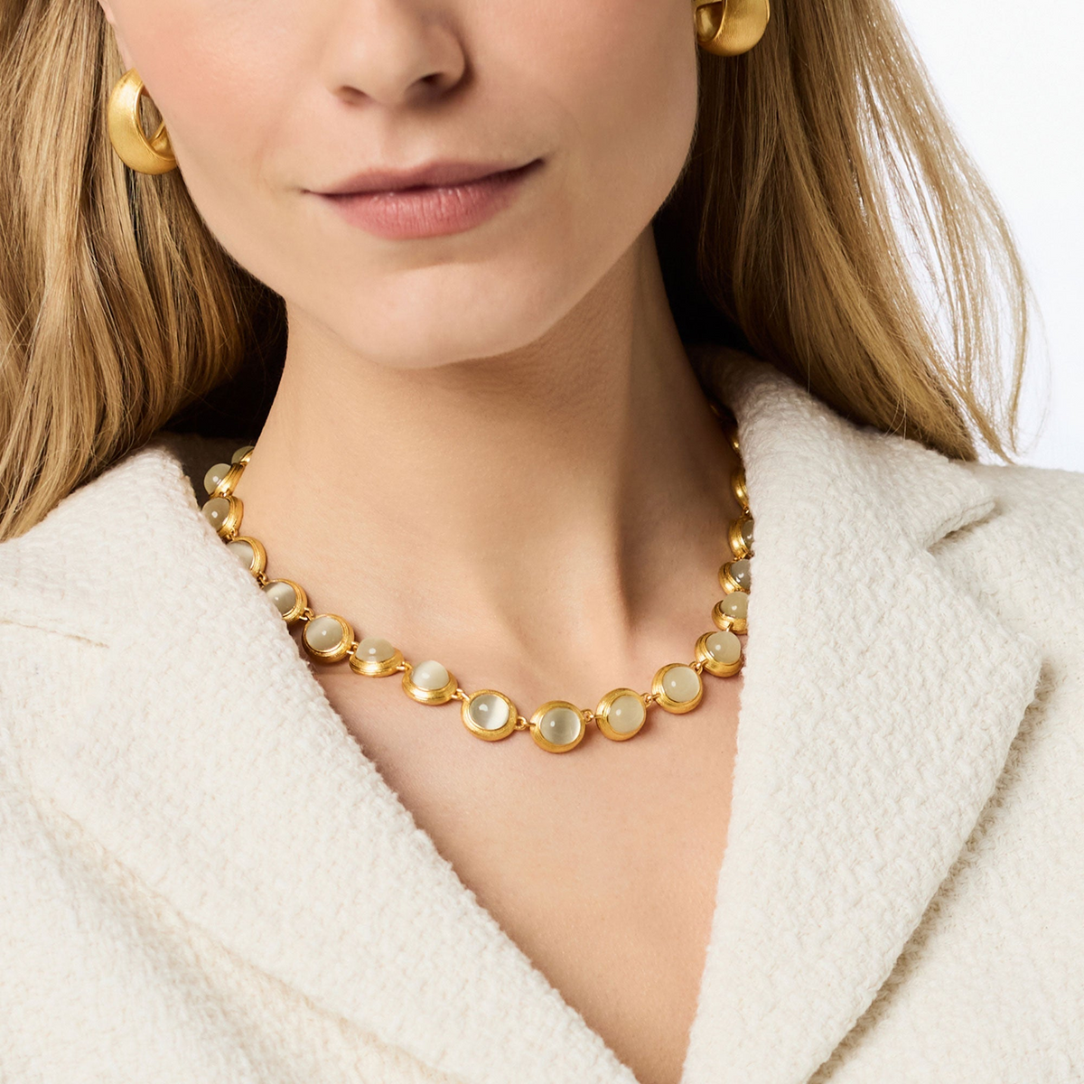 Woman wearing the Cobblestone Tennis Necklace in 24K gold plate with round glass stone accents.