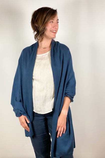Solid cashmere scarf in a neutral tone with soft drape.