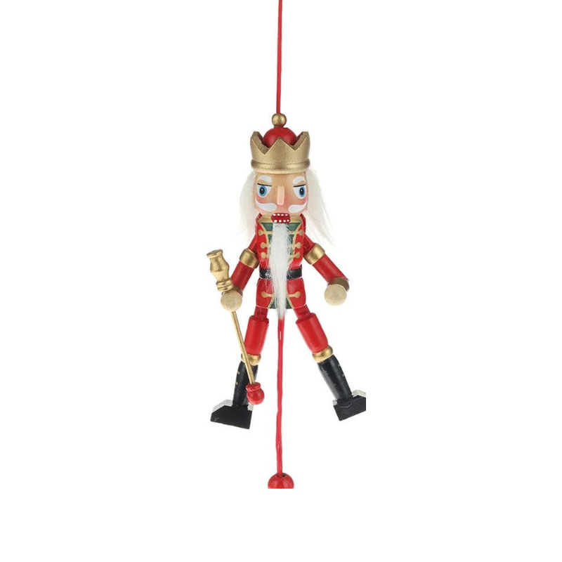 5-inch wooden nutcracker pull puppet ornament with a gold crown, red uniform, and movable limbs.