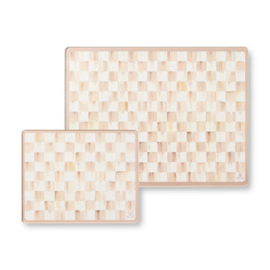 Set of two mocha check patterned tempered glass cutting boards in small and large sizes.