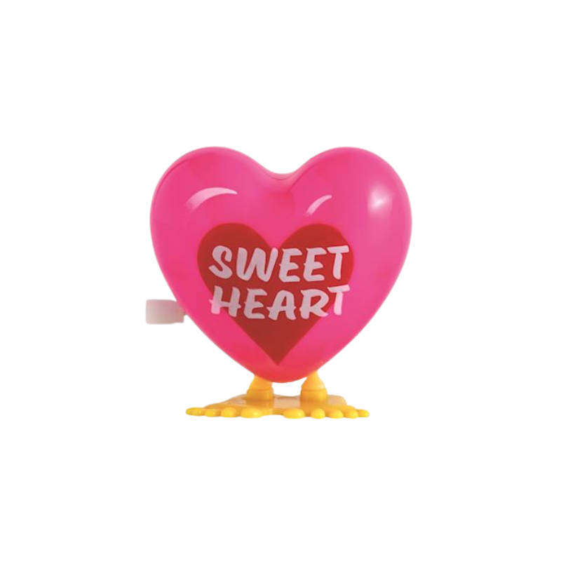 Pink wind-up hopping heart toy with yellow feet and 'SWEET HEART' printed on a red heart center.