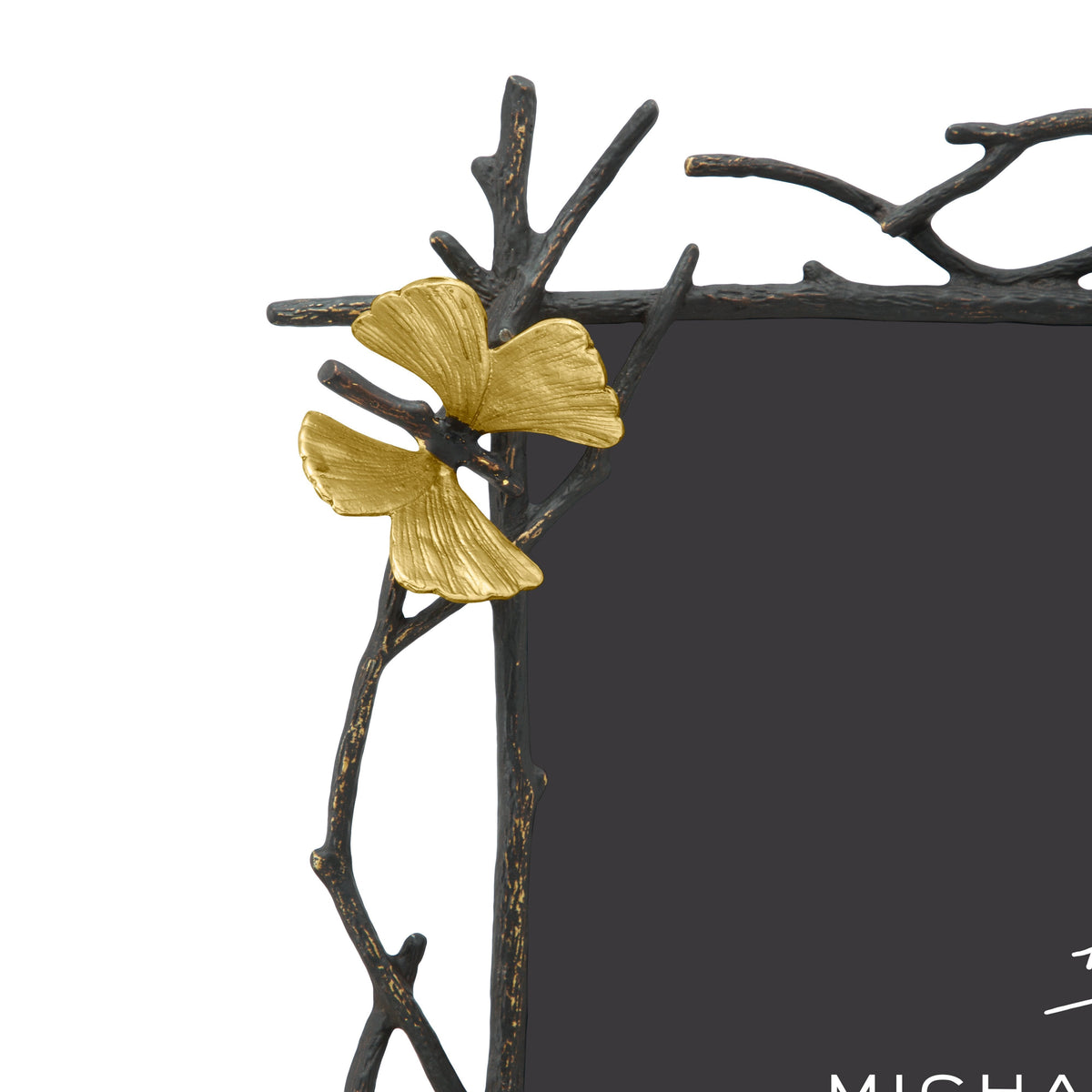 Oxidized goldtone convertible butterfly ginkgo picture frame holding an 8x10 photo.