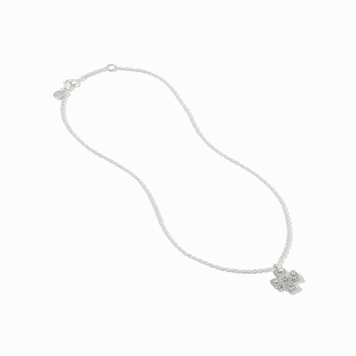 Silver Canterbury delicate necklace featuring a hand-hammered cross pendant on a fine chain.