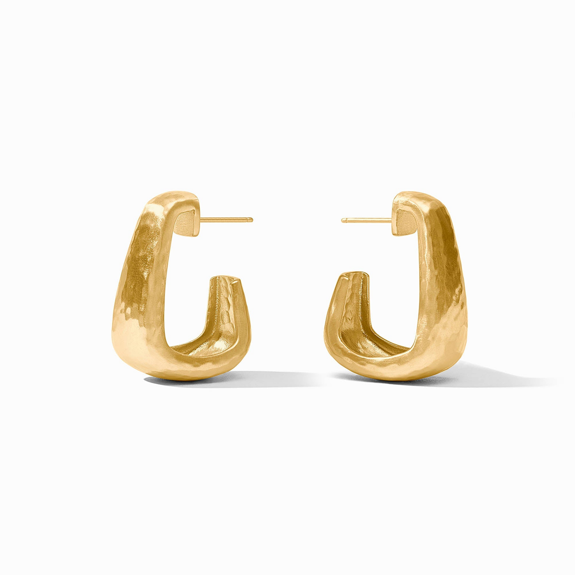 A pair of Sahara Hoop earrings in 24K gold plate with a hammered texture and post back.
