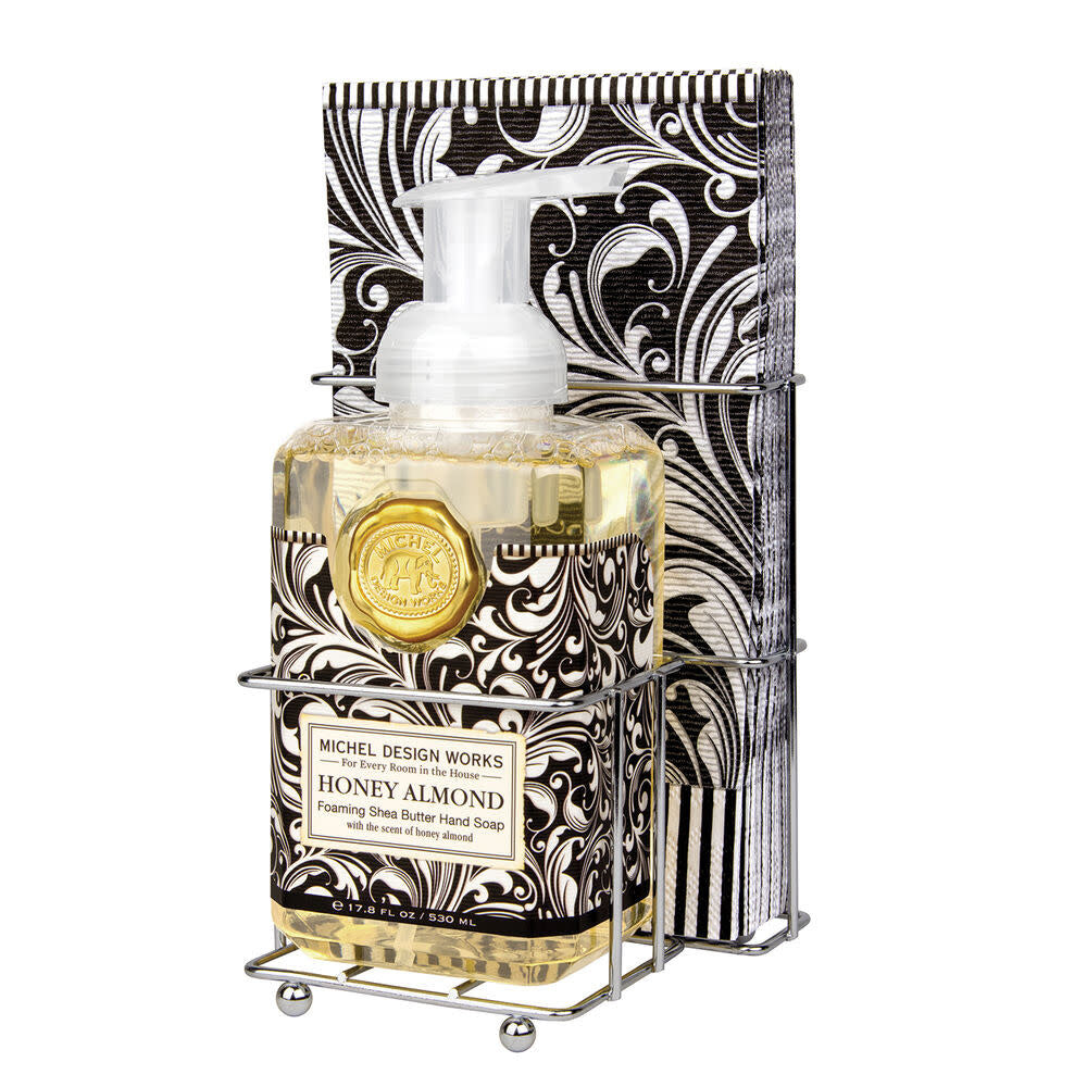 Foaming hand soap dispenser in honey almond with a pack of fifteen napkins.