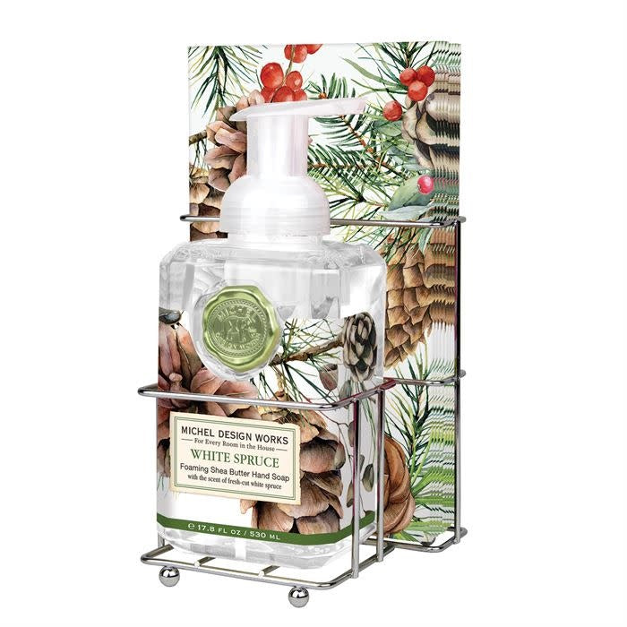 White foaming hand soap bottle with matching napkins in a spruce-themed set