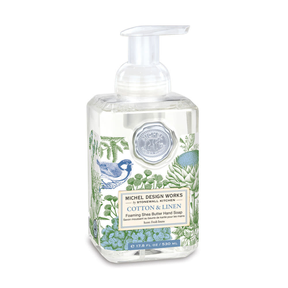 Foaming hand soap dispenser in a clear bottle with white liquid inside.