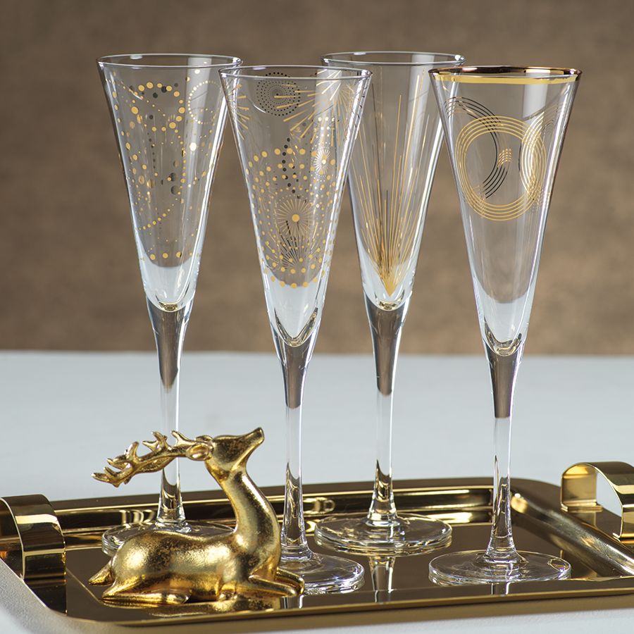 Clear glass champagne flute with a slender stem and flared bowl.
