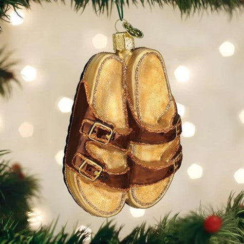 Glass Christmas ornament shaped like a pair of brown and gold double-strap sandals.
