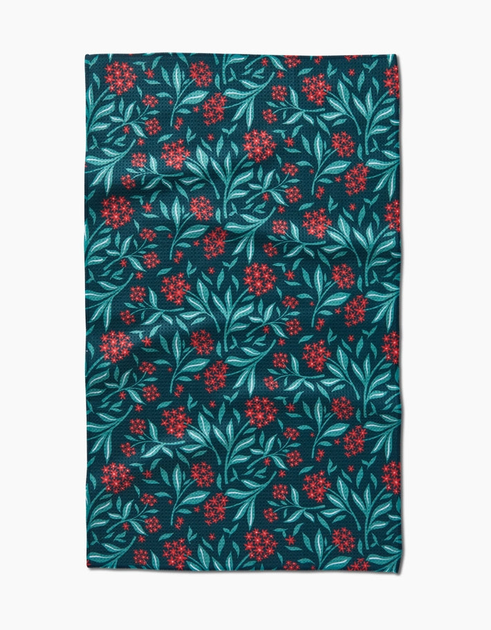 Holiday tea towel with waffle weave construction featuring a festive seasonal print.