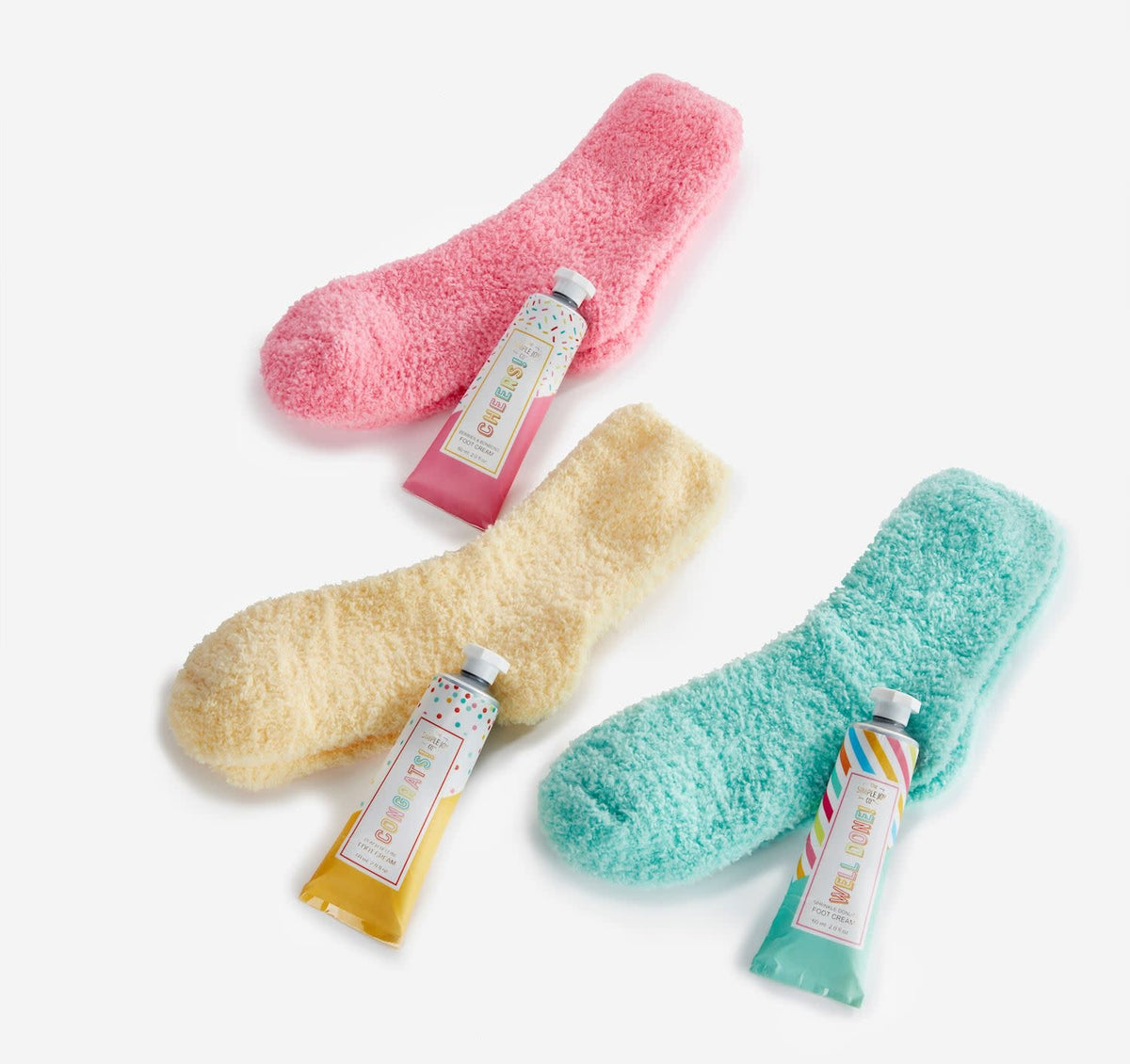 Foot Care Gift Set in a botanical floral paper box with ribbon containing scented cream and colorful socks.