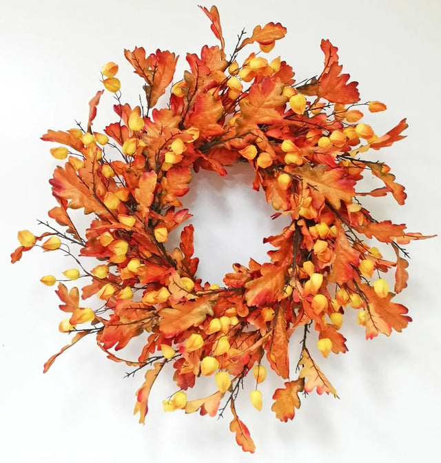 Oak leaf wreath with lantern detail in warm brown tones
