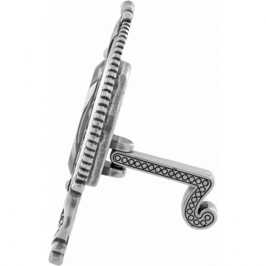 Silver plated side view of a small clock with swivel arm, scrolled floral accents, and crystal face.