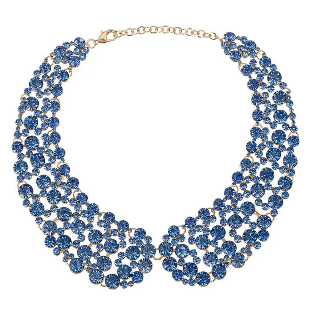 Exaggerated gold-tone collar necklace featuring a wide bib of sparkling blue glass rhinestones.
