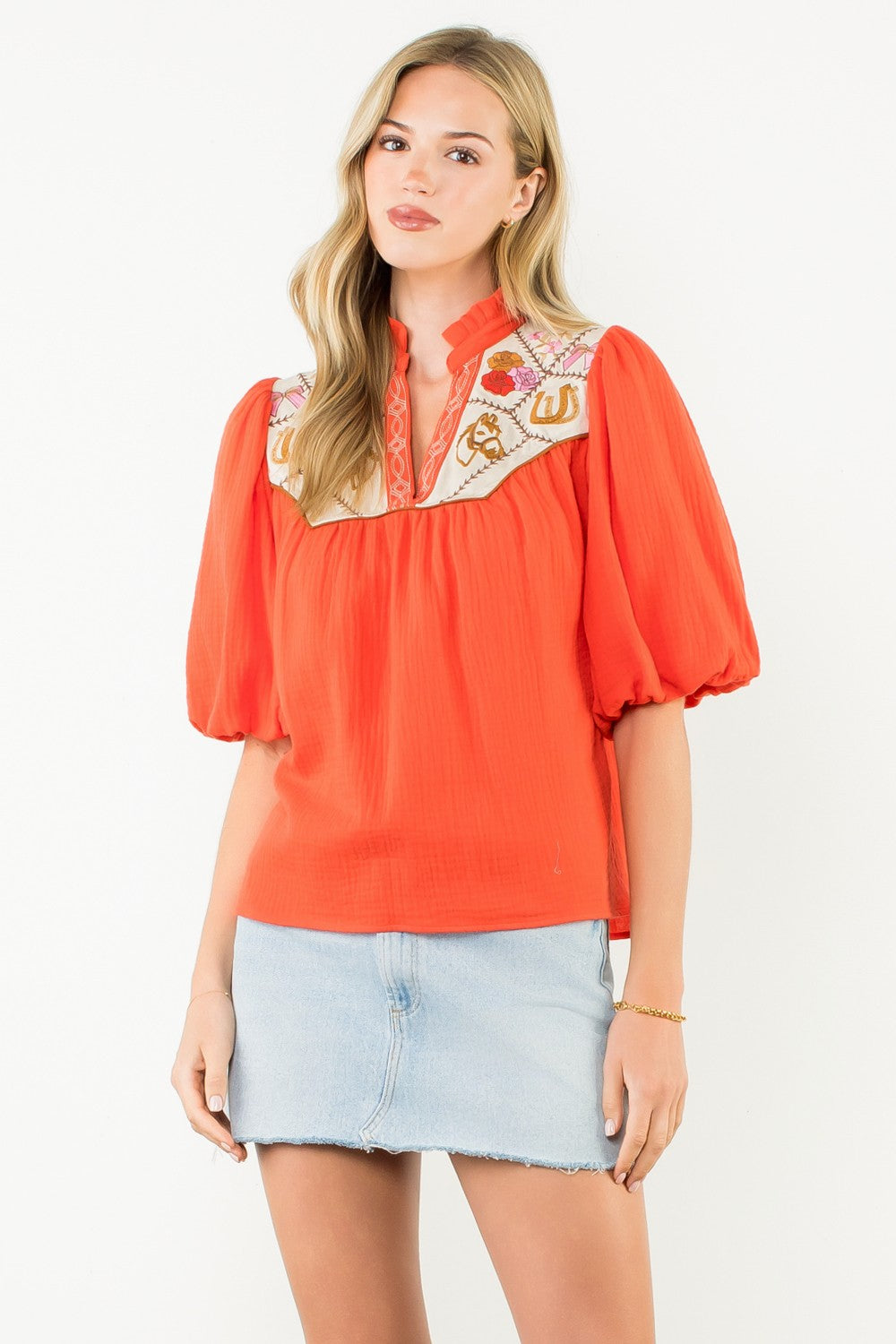 Women's white cotton top with puff sleeves and embroidered neckline