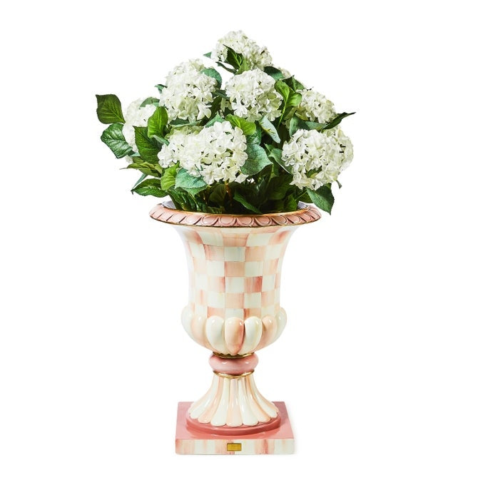 Rosy check pedestal urn made of fiberglass resin with a round shape.