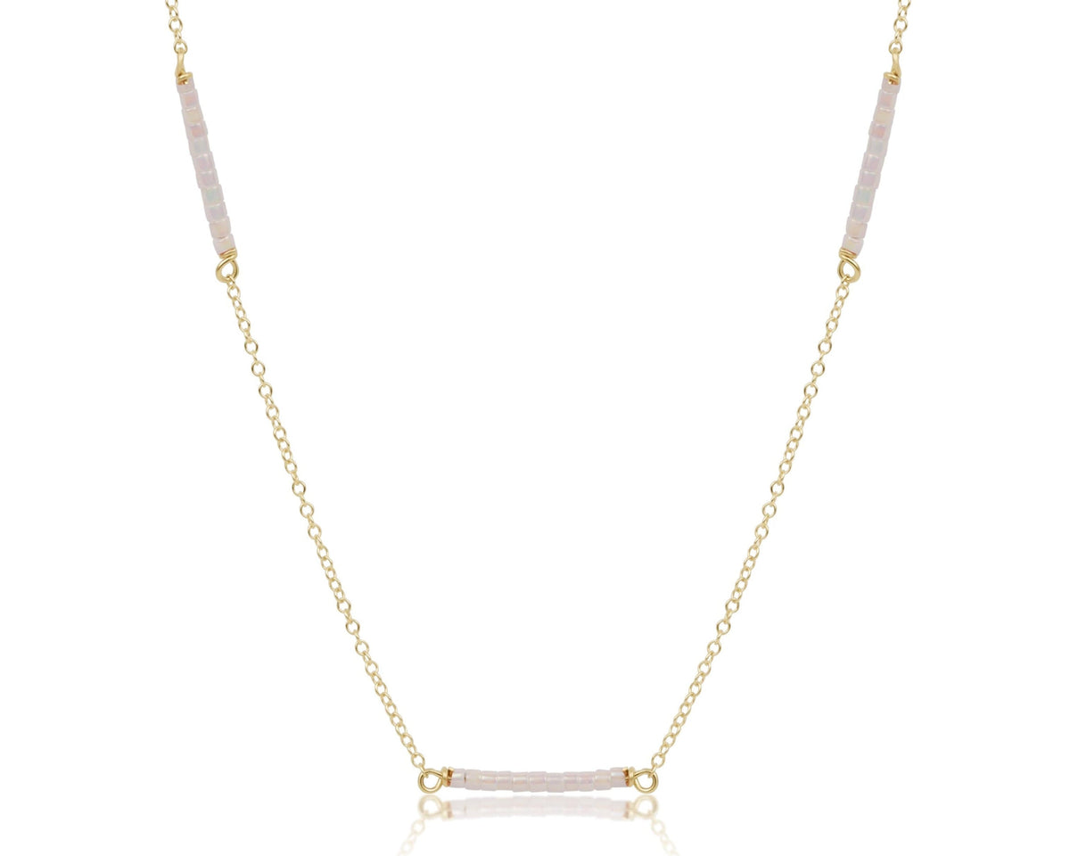 15 inch gold-filled choker chain with three sections of light pink seed beads.