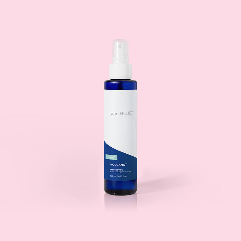 Bottle of Volcano Dry Body Oil in a clear glass container with an orange label.