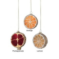 Set of three 3.5-inch glass sliced fruit ornaments: pomegranate, orange, and lemon.