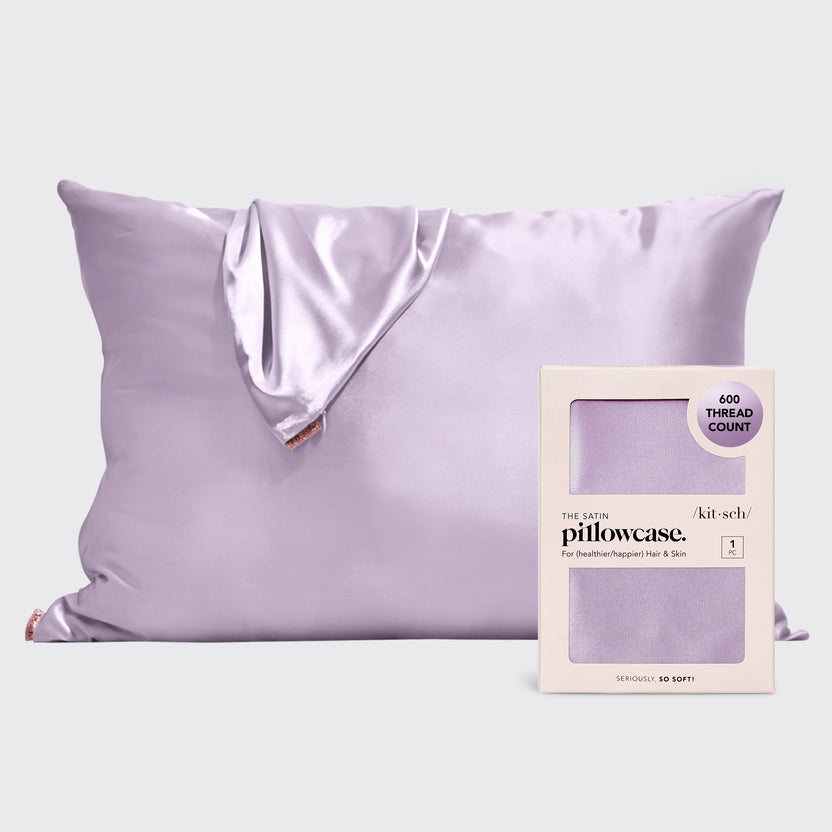 Satin pillowcase in a soft neutral tone with smooth texture.