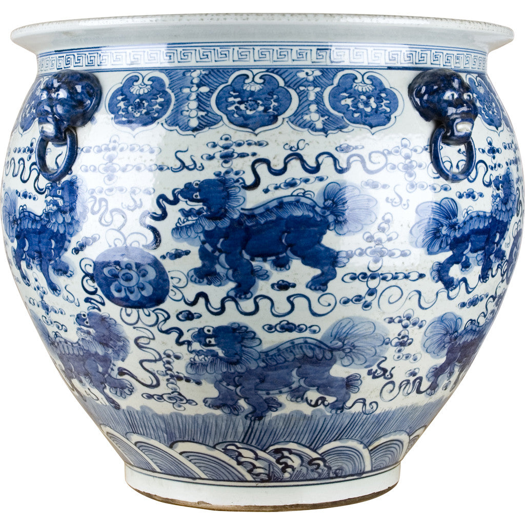 Blue and white porcelain foo dog figurine with traditional fishbowl shape.