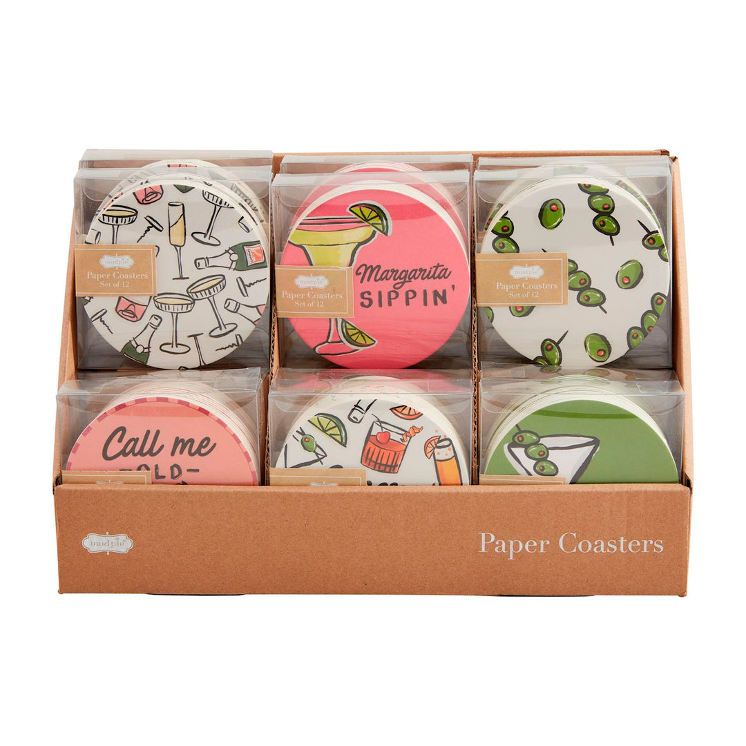 Display box containing six different sets of round cocktail-themed paper coasters.