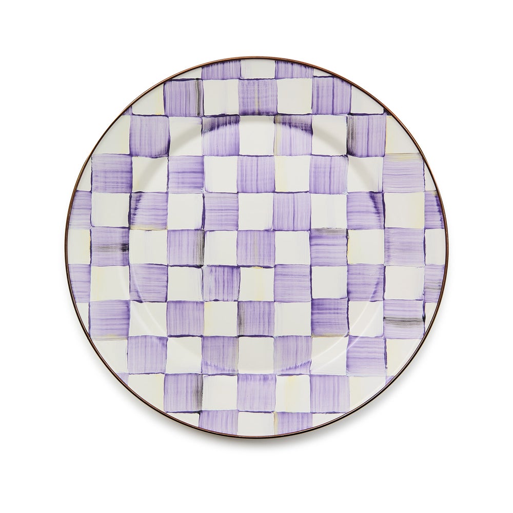 Hand-glazed steel charger plate with violet checkered pattern on a bronzed stainless steel rim.