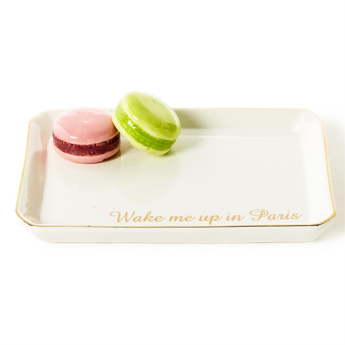 White ceramic trinket tray with pink and green macaron icons and 'Wake me up in Paris' in gold.