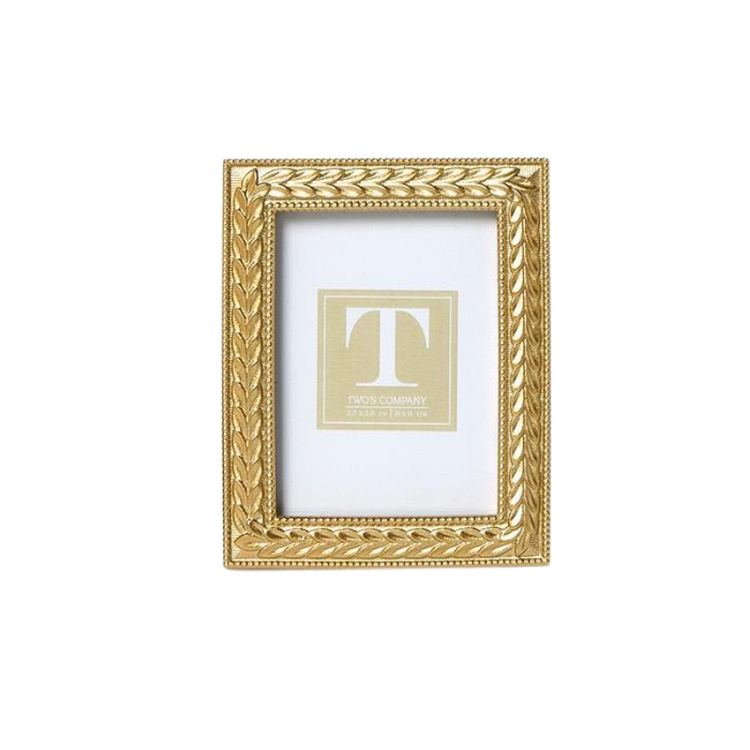 Rectangular gold photo frame with an intricate laurel wreath design and beaded inner border.
