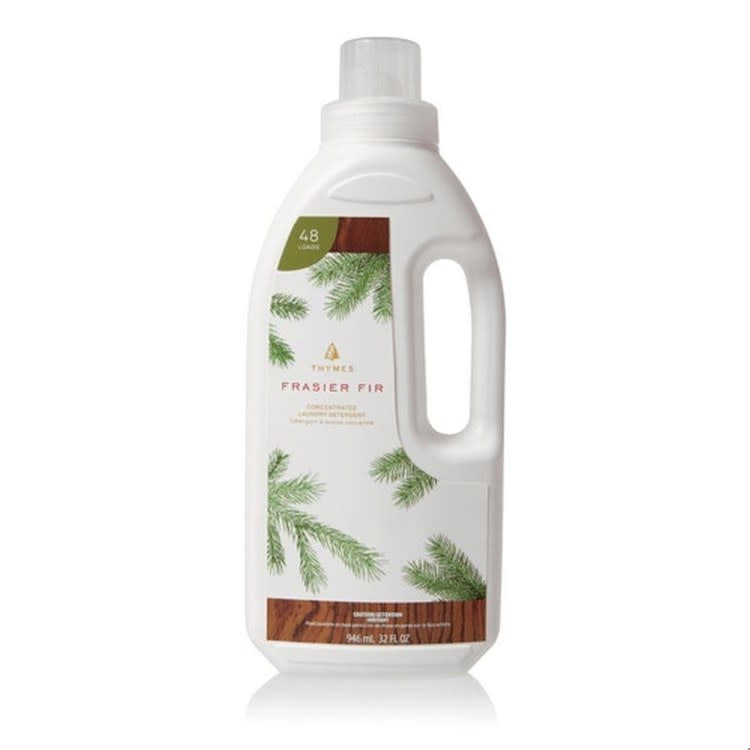 Bottle of Frasier Fir concentrated laundry detergent with a natural wood scent.