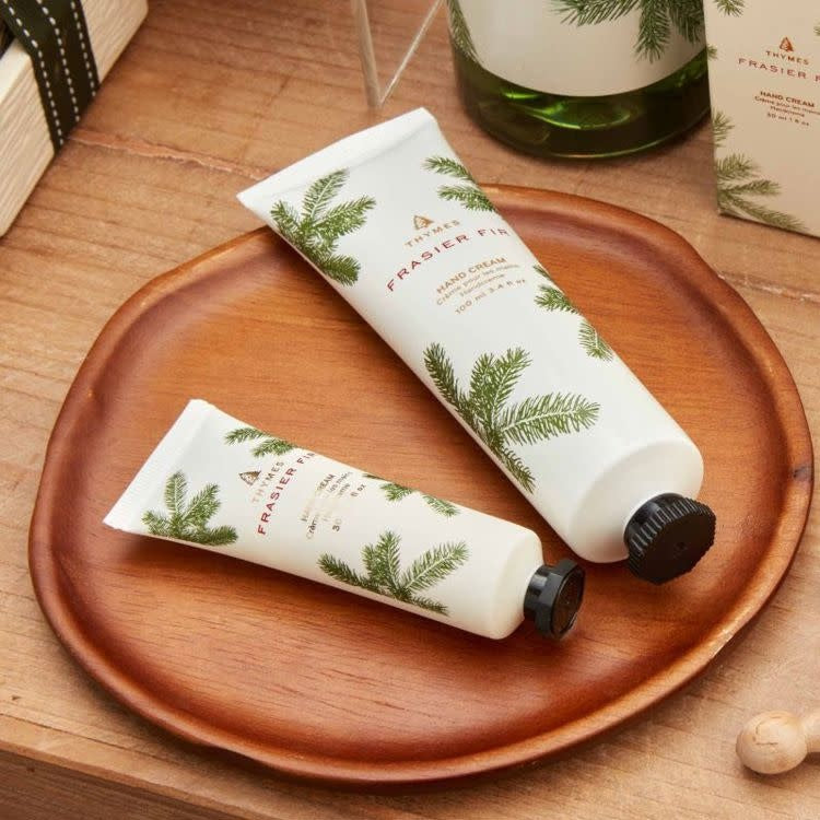 Petite Frasier Fir hand cream in a compact white bottle with silver cap.