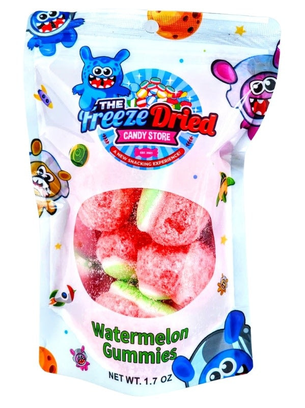 Freeze-dried crunchy gummy watermelon slices in bright red with green rind accents.