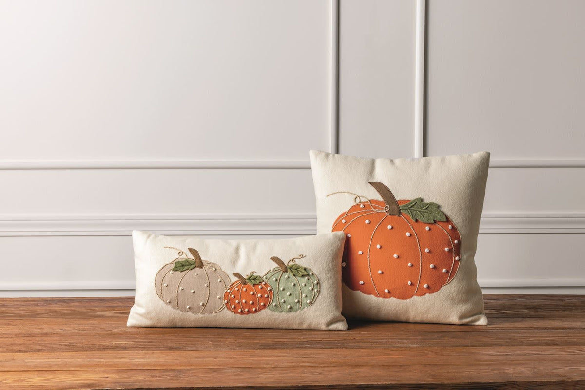 Eighteen-inch square felted wool pillow with pumpkin appliqué, French knots, and canvas backing.