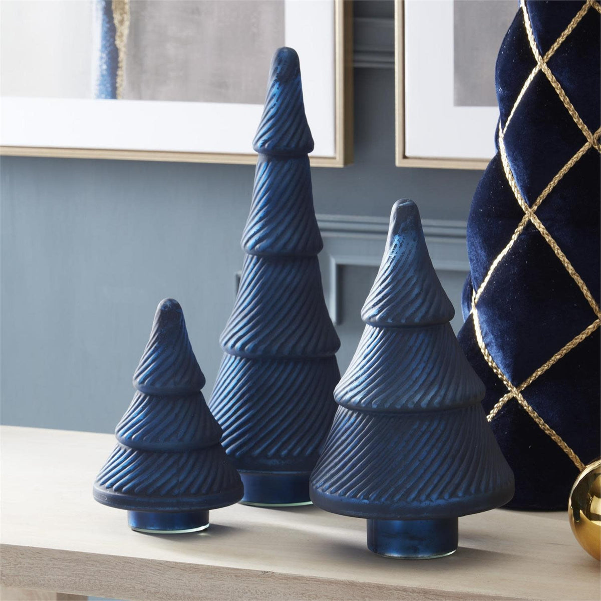 Frosted blue pressed glass Christmas tree with vintage charm on a tabletop
