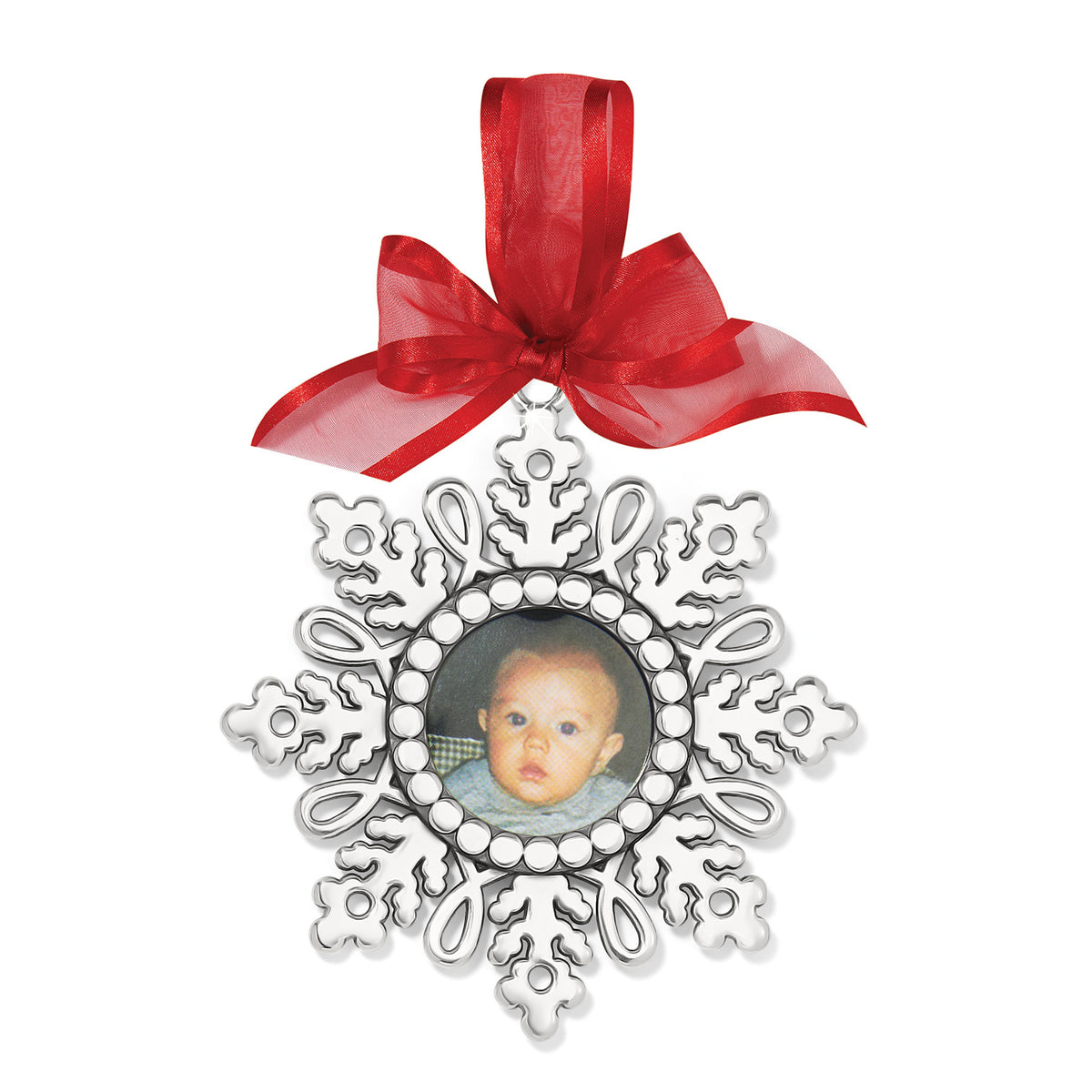Silver-plated snowflake ornament with a delicate photo imprint on its surface.
