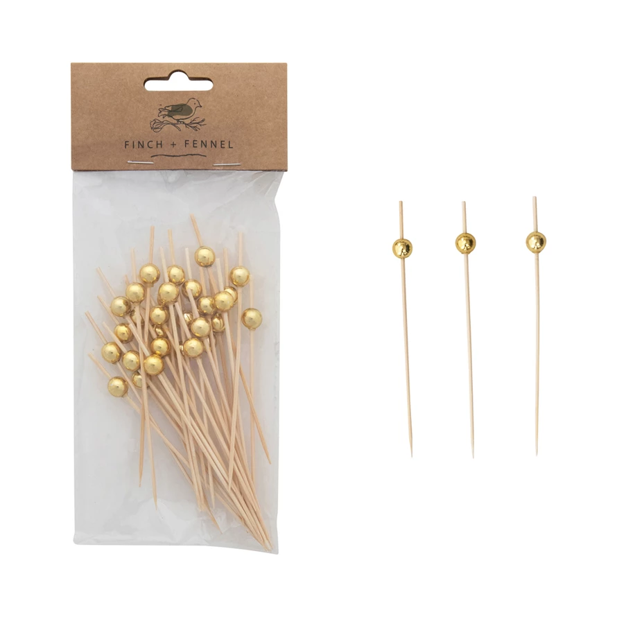 Set of fifty bamboo appetizer picks with natural wood bodies and gold ball handles.
