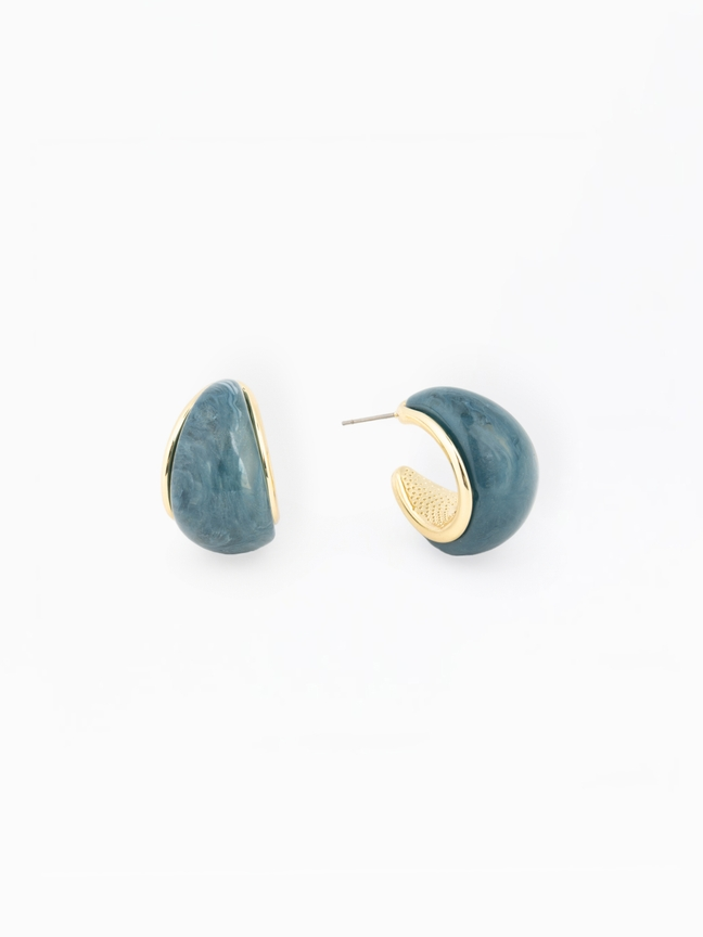 Veyda Earrings featuring blue marbled resin and gold-plated brass in a chunky hoop design.