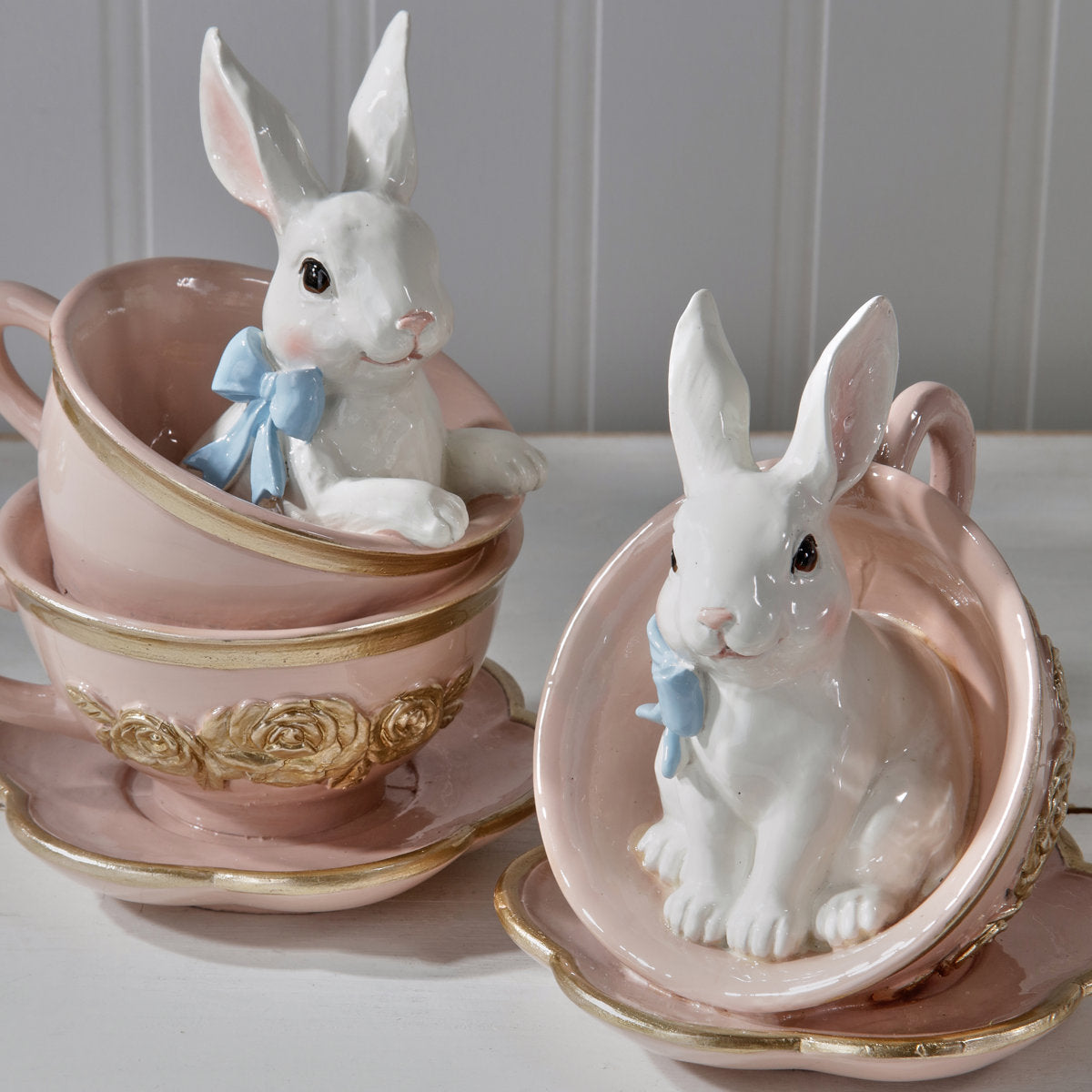 Hand-painted resin bunny teacup accent piece with sculpted ears on a stand.