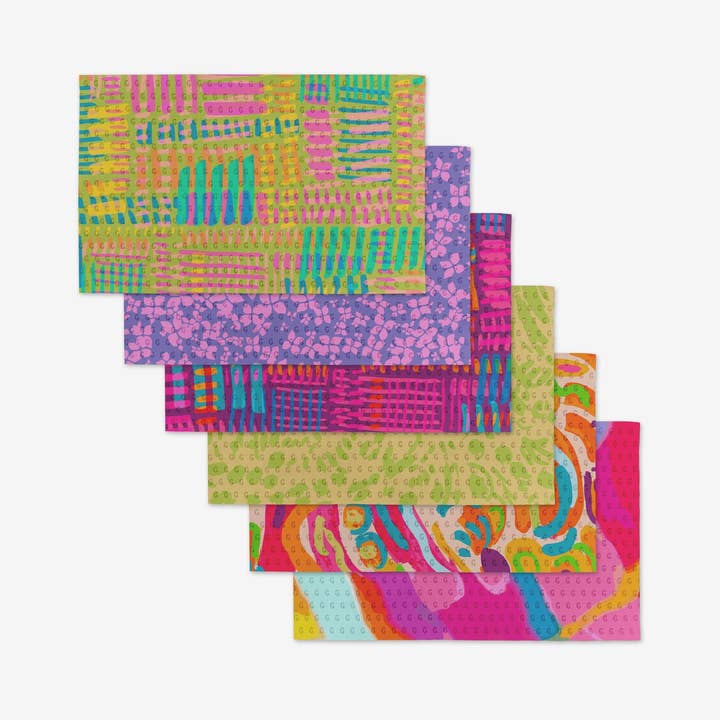 Set of reusable kitchen cloths made from post-consumer recycled materials in a neutral tone.