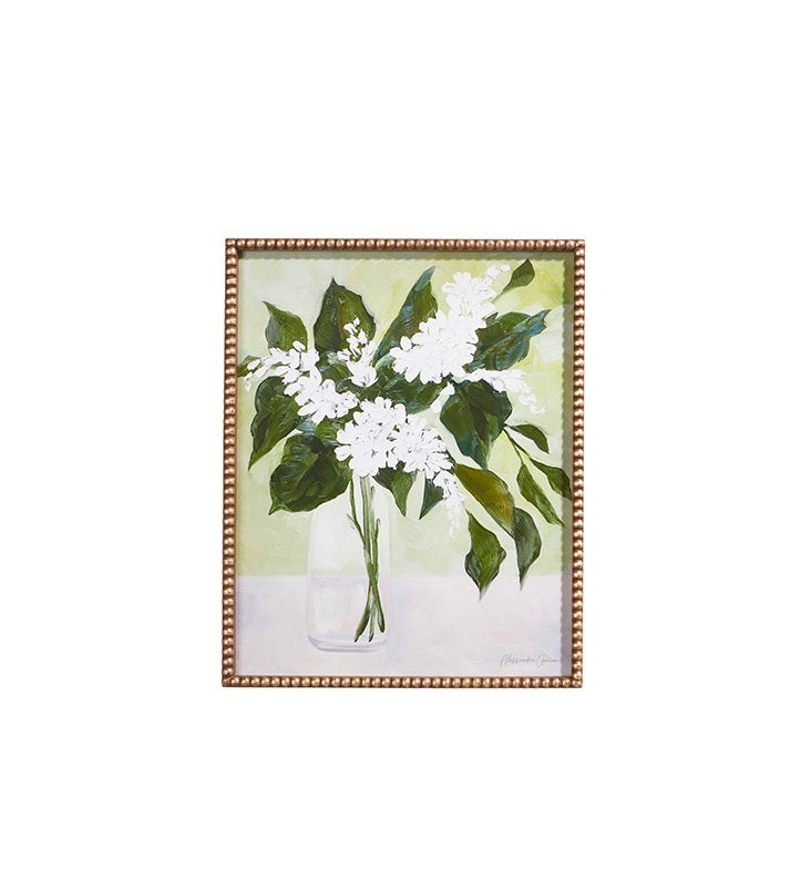 Framed print showing white flowers in a vase on wood and glass background