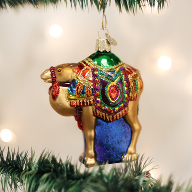 Magi's Camel Ornament: a small camel figurine with brown body and gold accents representing the Wise Men's caravan.