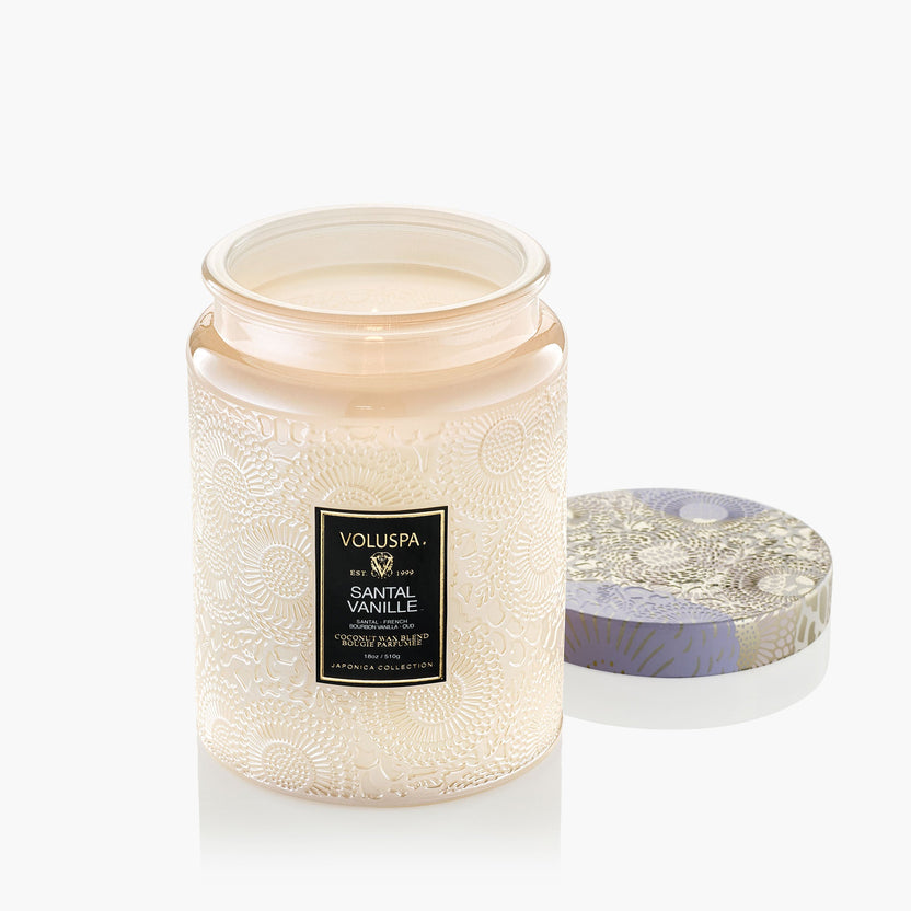 Santal Vanille candle in a clear glass jar with natural wick