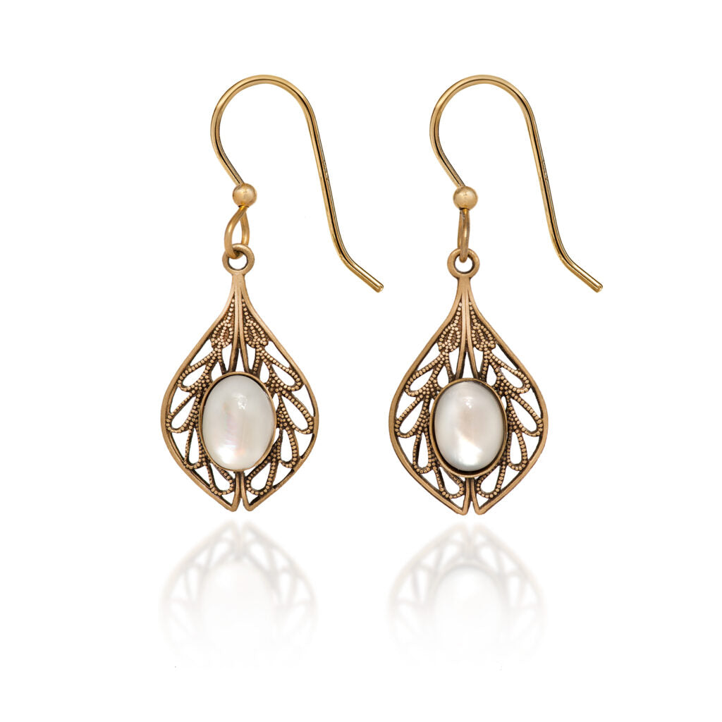 Gold filigree teardrop earrings with oval white stones and fish hook backs.