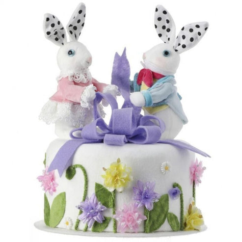 Styrofoam cake topper shaped as a bunny wearing a floral bow