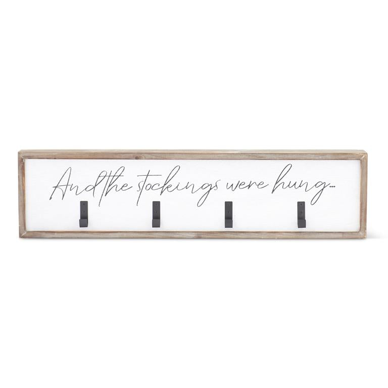Wooden stocking hanger with four hooks designed to hold stockings